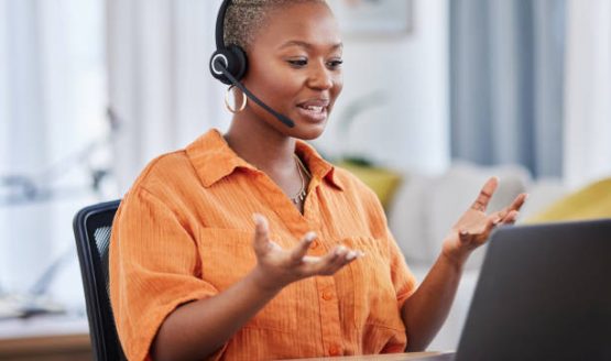 istockphoto-1620440886-612×612 Black woman, call center and consulting on laptop in customer service, support or telemarketing at home. African female person or consultant agent talking on computer with headphones in online advice